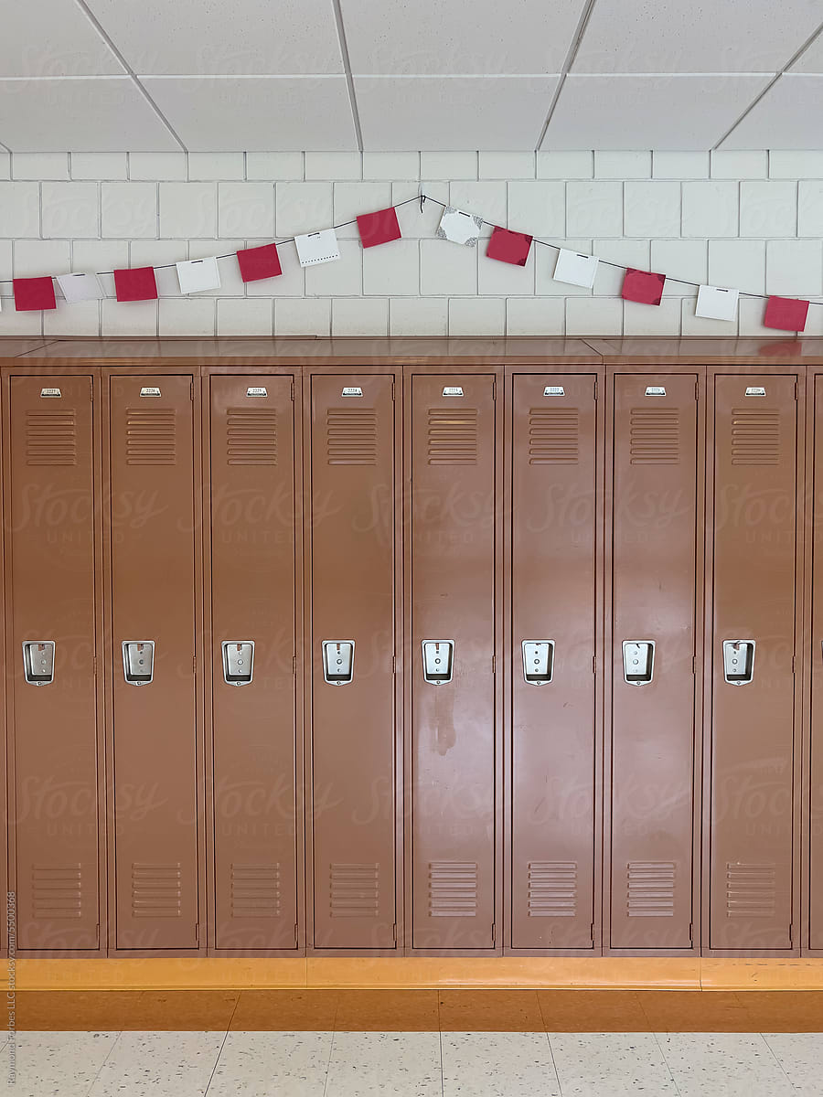 Wall of brown Lockers in  Hallway at American High School
