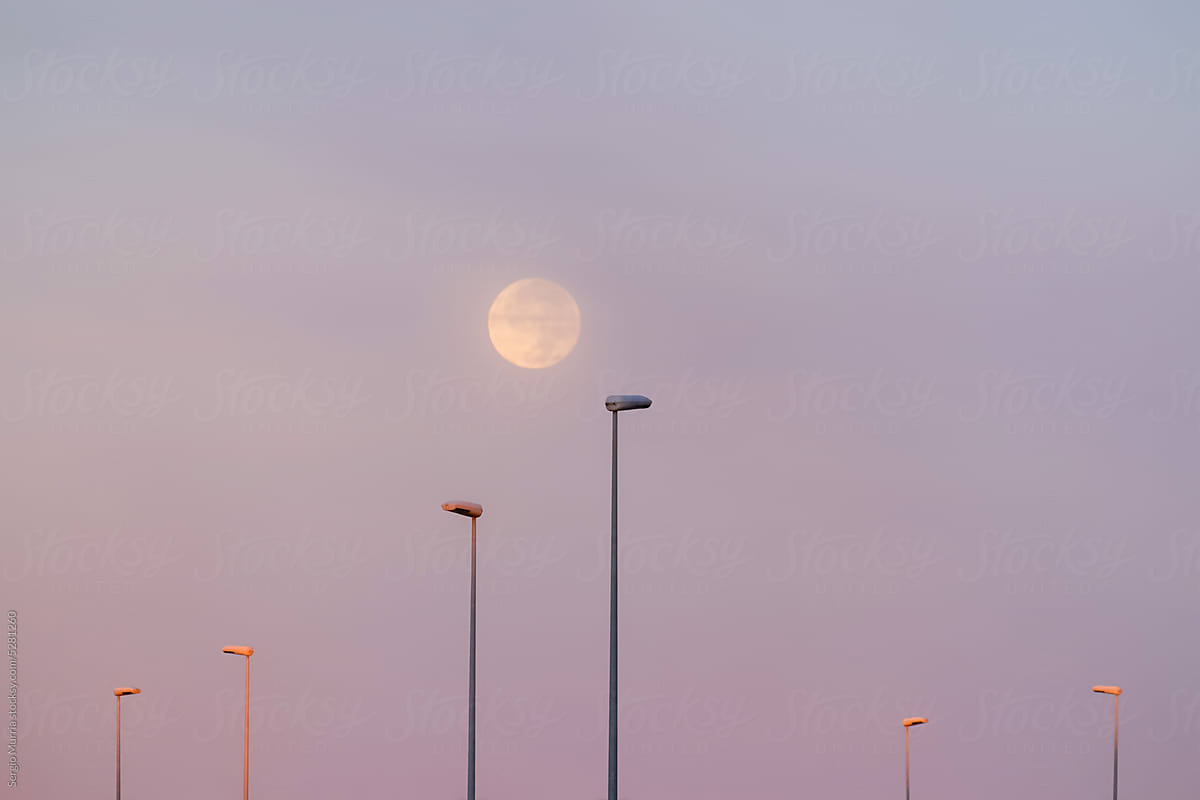 full moon over sunrise