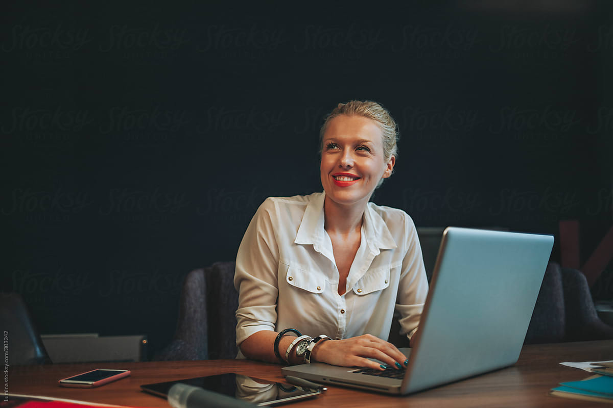 Smiling Businesswoman At Work Del Colaborador De Stocksy Lumina Stocksy
