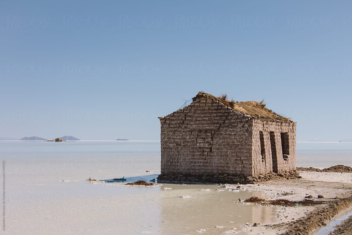 Lonely old house in shore of lake. Uyuni salt flat
