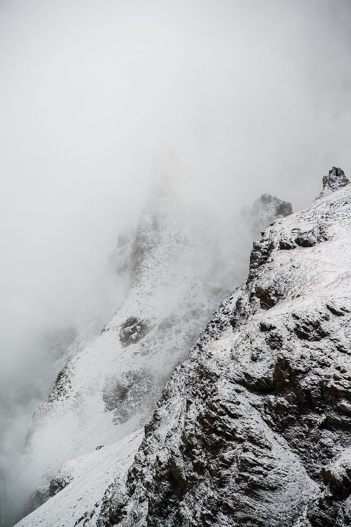 Snow covered cliffs with fog