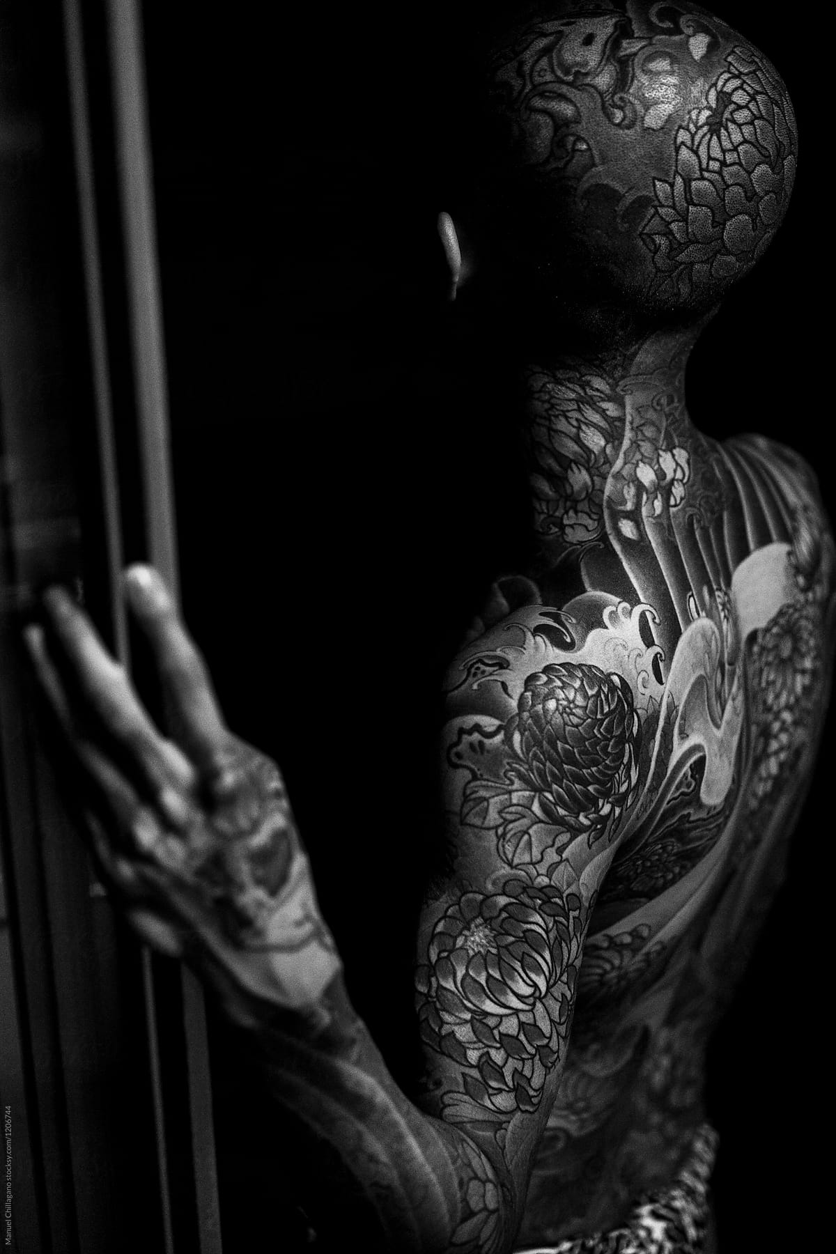 Black and White portrait of a heavily tattooed Japanese man