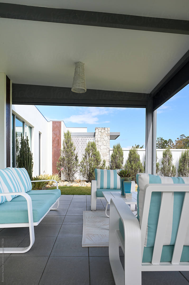 Covered patio with stylish furniture
