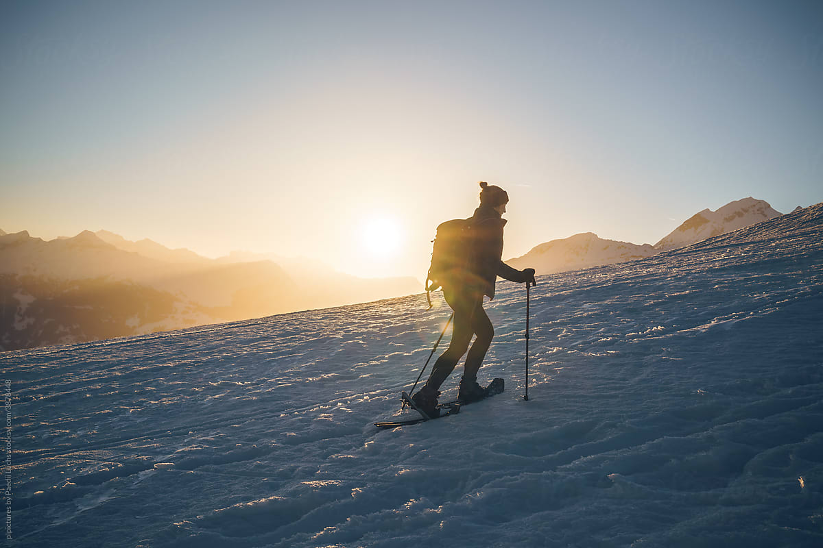 One woman hiking in winter landscape with snowshoes Stock Image