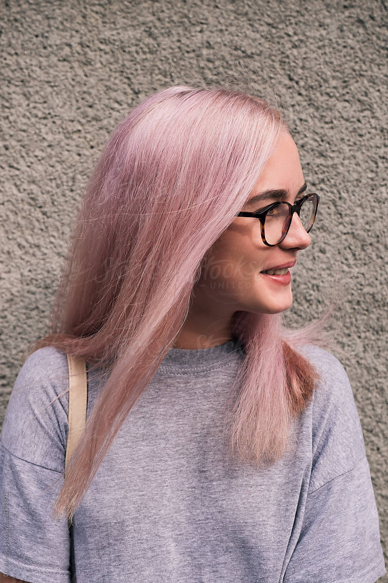 Smiling Young Girl With Pink Hair In Eyeglasses By Stocksy Contributor Danil Nevsky Stocksy