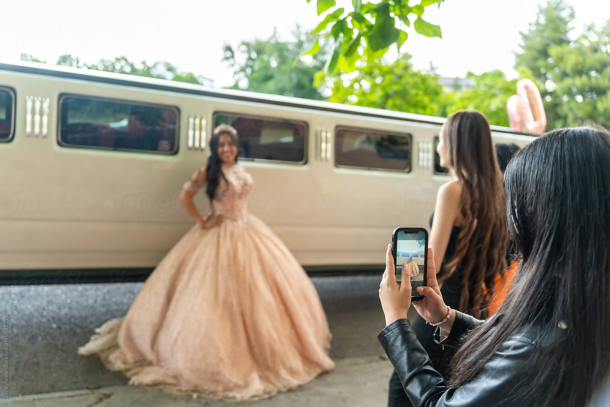Portrait Of A 15th Birthday Party Next To A Limousine.