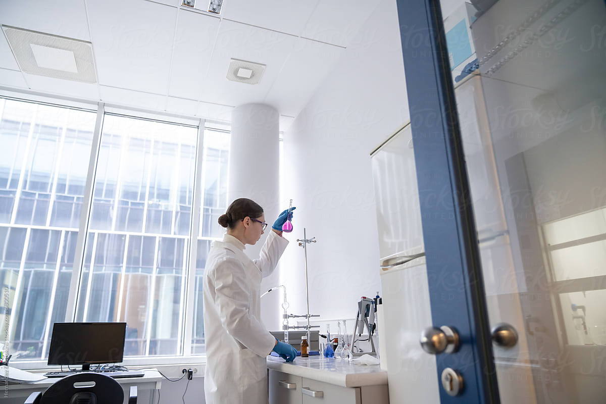 Researcher Analysing Sample In The Modern Lab