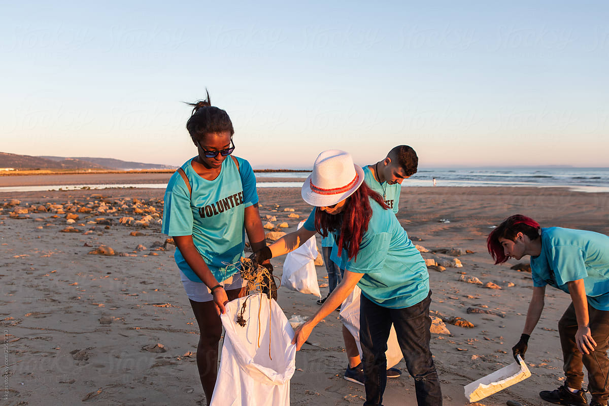 Volunteers picking up trash on the beach