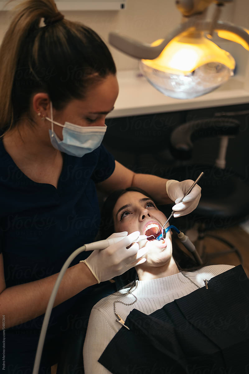 Young woman receiving treatment at the dentist
