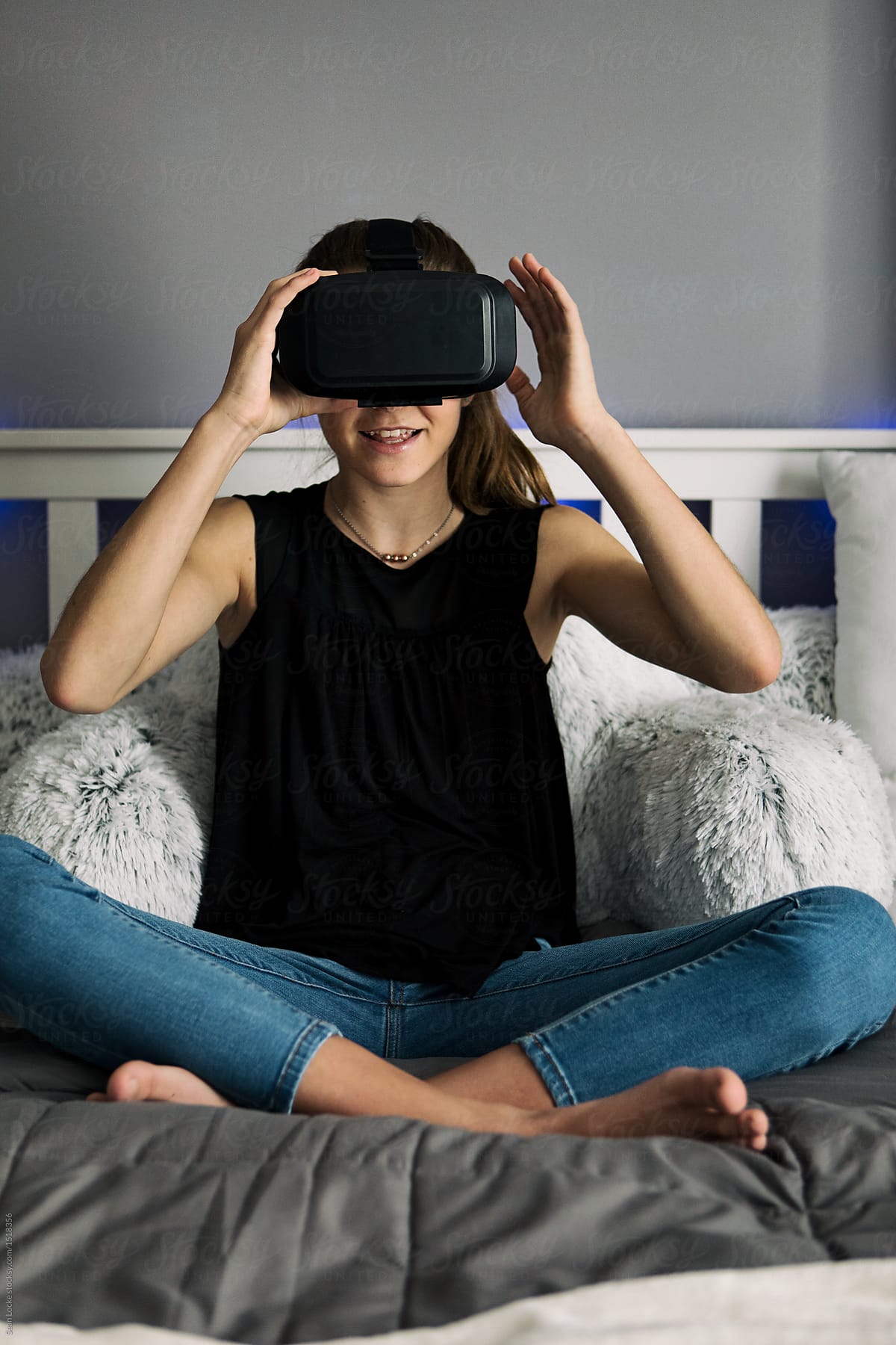 Teenager: Teen Female Putting On VR Visor