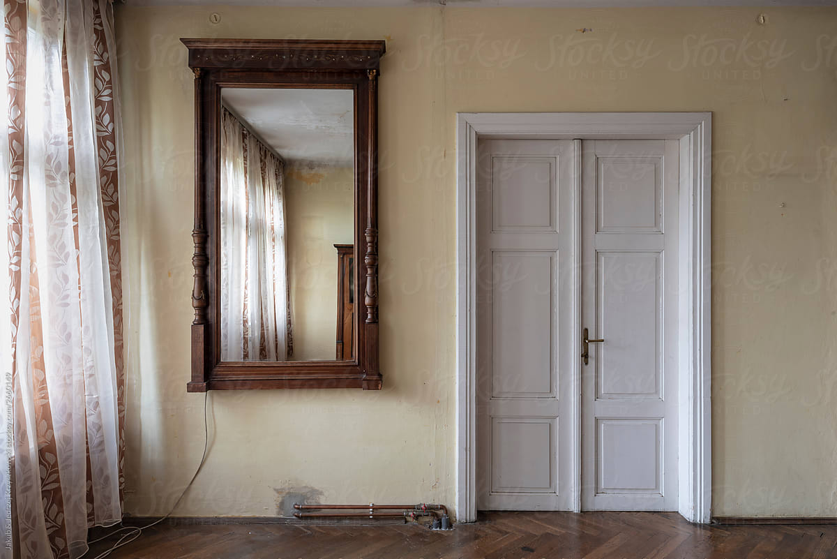 Doors and big luxury mirror in the antique house
