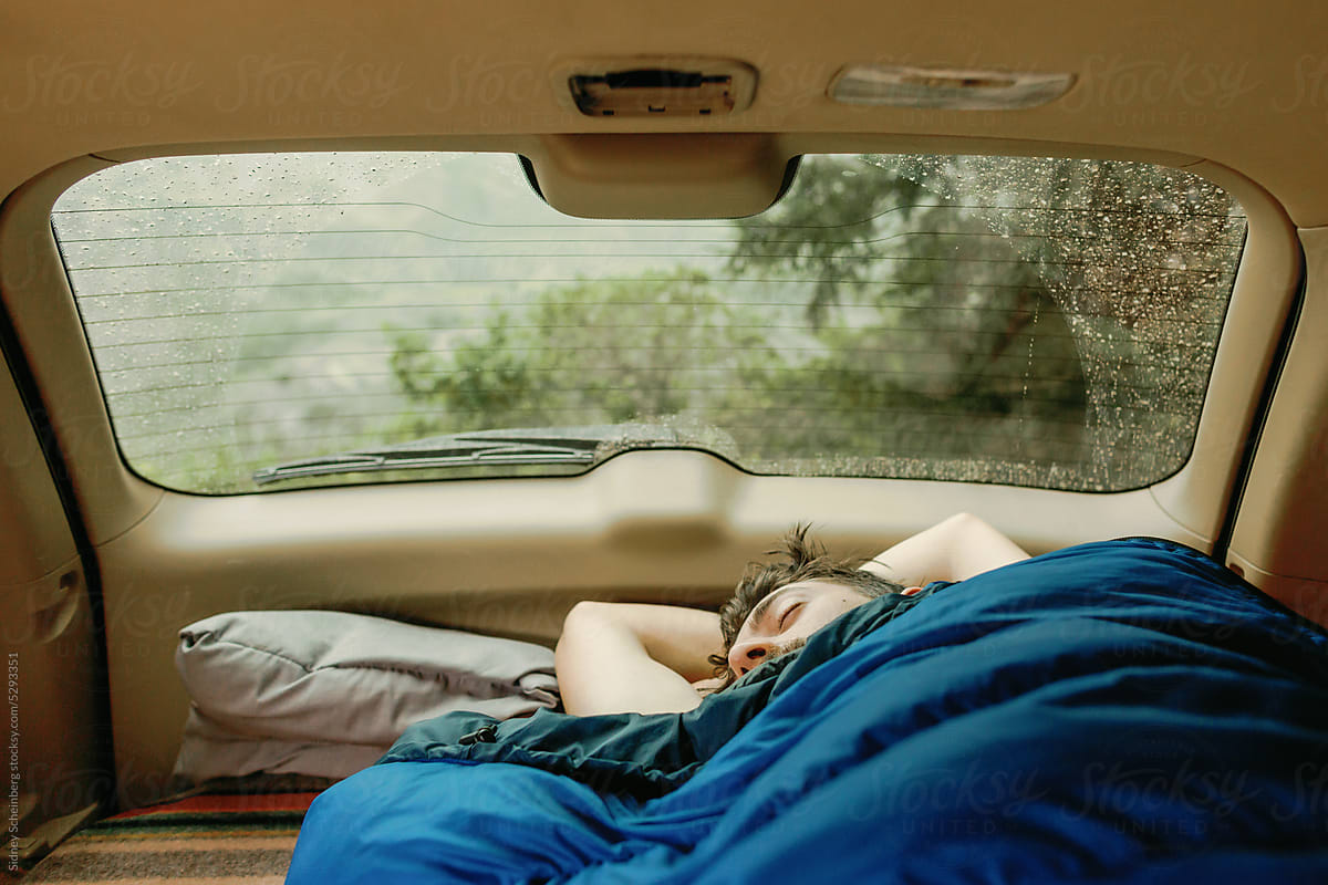 Man Sleeping in Car