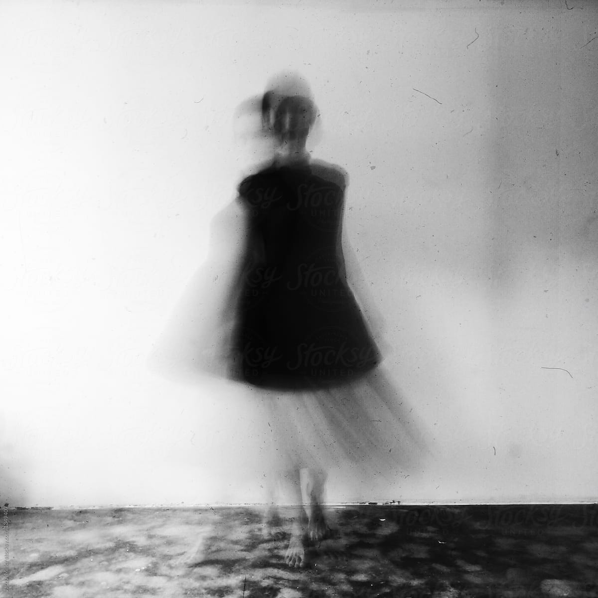 Blurred black and white of woman moving toward camera