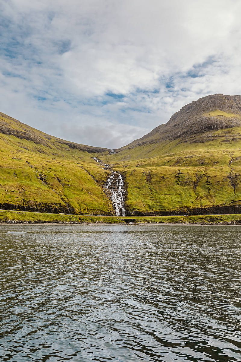 Water cascade falling into the sea in Faroe Islands