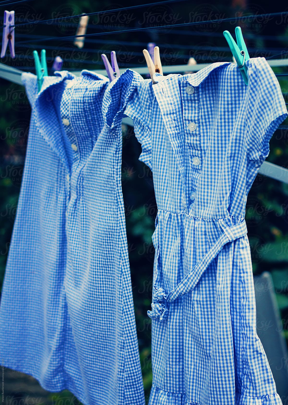 School dresses hanging on a washing line