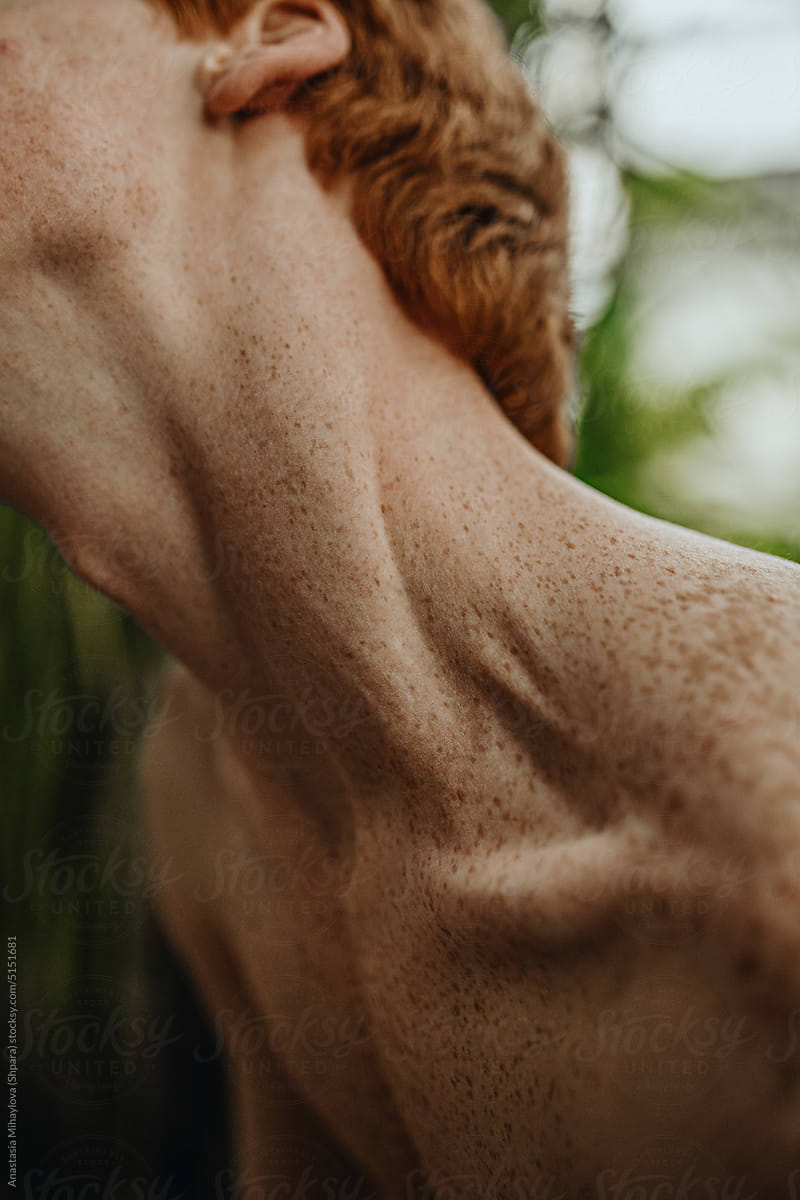 Close-up Freckled Ginger Man\'s Neck in the Jungle