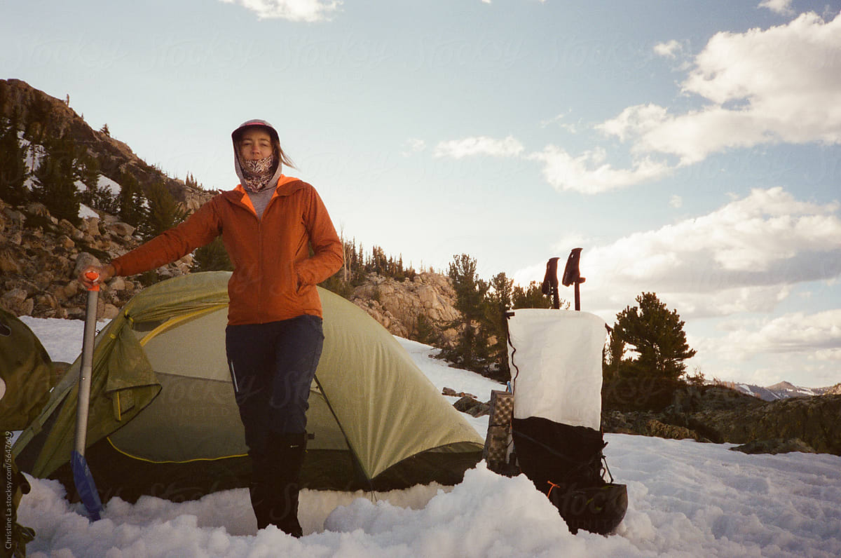 Mountaineer woman camping in the snow
