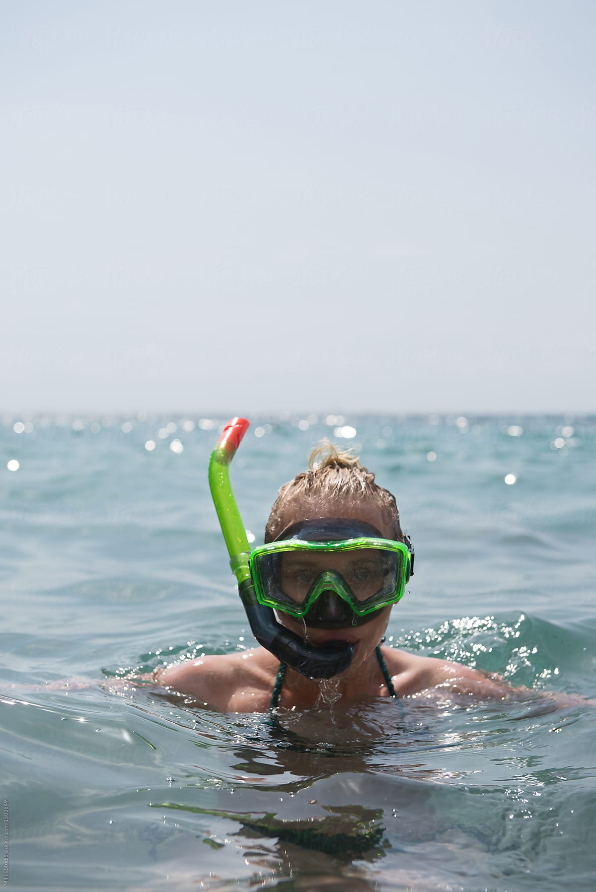 Woman swimming with snorkeling mask