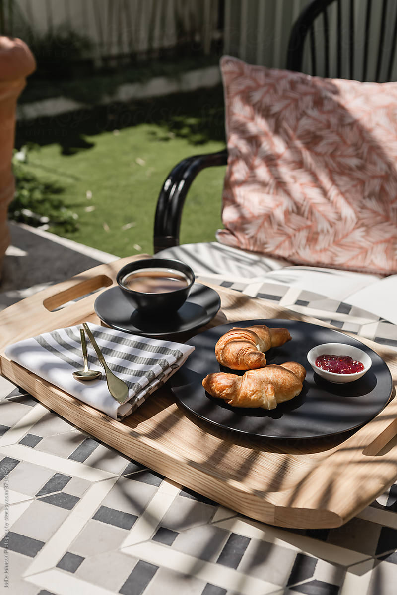 Croissant and coffee outside