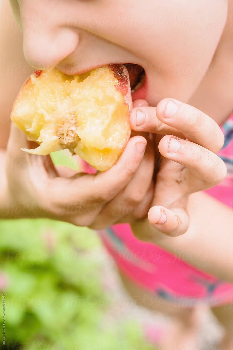 Close up of a Girl Eating a Juicy Peach