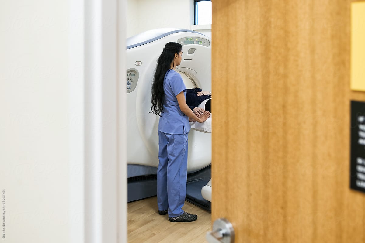 Clinic: Nurse Inside CT Scan Room With Patient