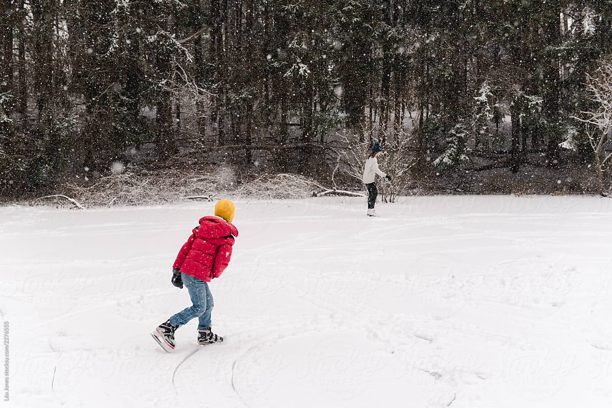 kids skating on a pond in New England