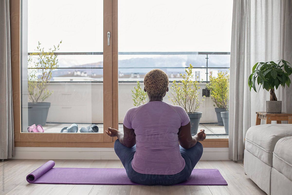 yoga at home, breathing exercise, black woman plus size meditating