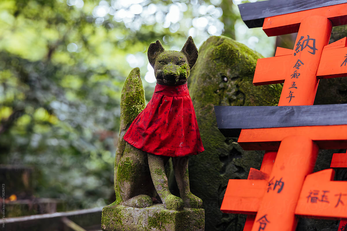 Moss-Covered Fox Statue at Fushimi Inari Shrine