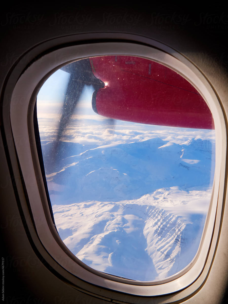 Greenland Arctic winter air travel - airplane window passenger view