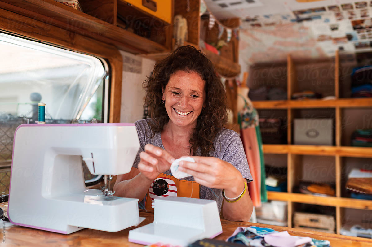 Woman sewing in small business
