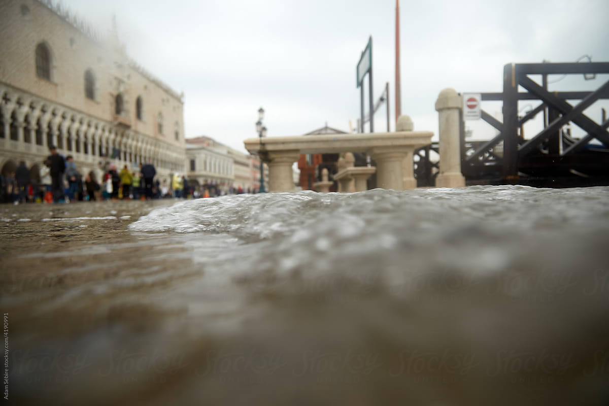 Sea level rise waves inundate and flood Venice,  Italy