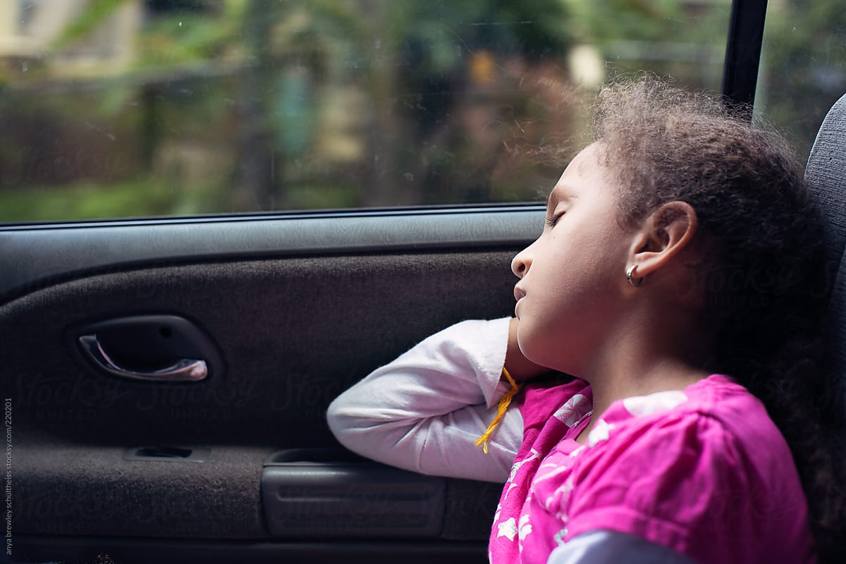 Sweet child sleeping soundly while in a car