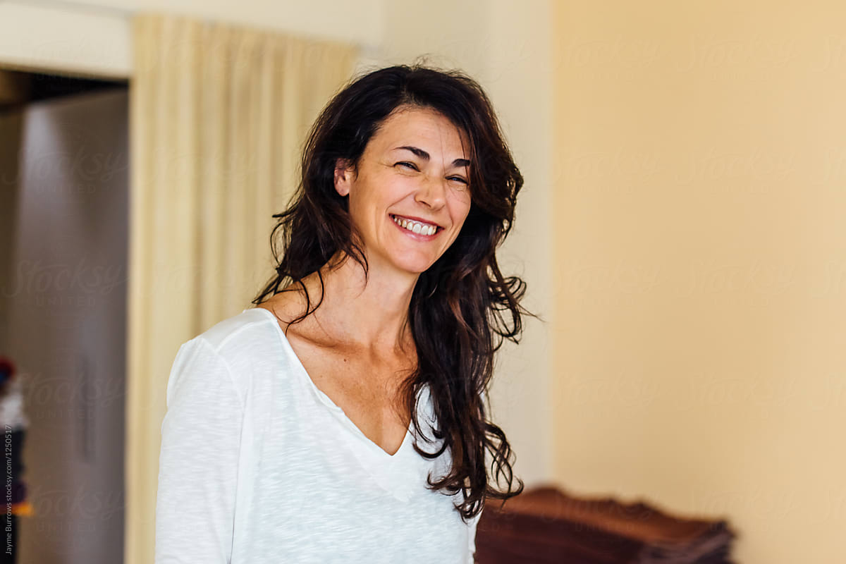 Portrait of a Woman Laughing in a Yoga Studio