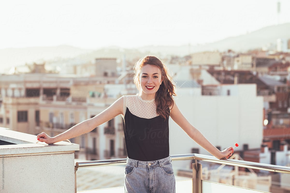 Smiling Woman On A Terrace By Stocksy Contributor Vera Lair Stocksy