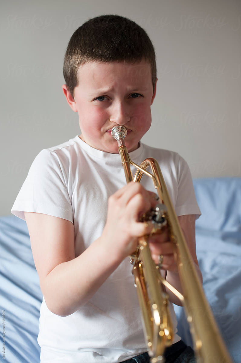 boy with trumpet musical instrument