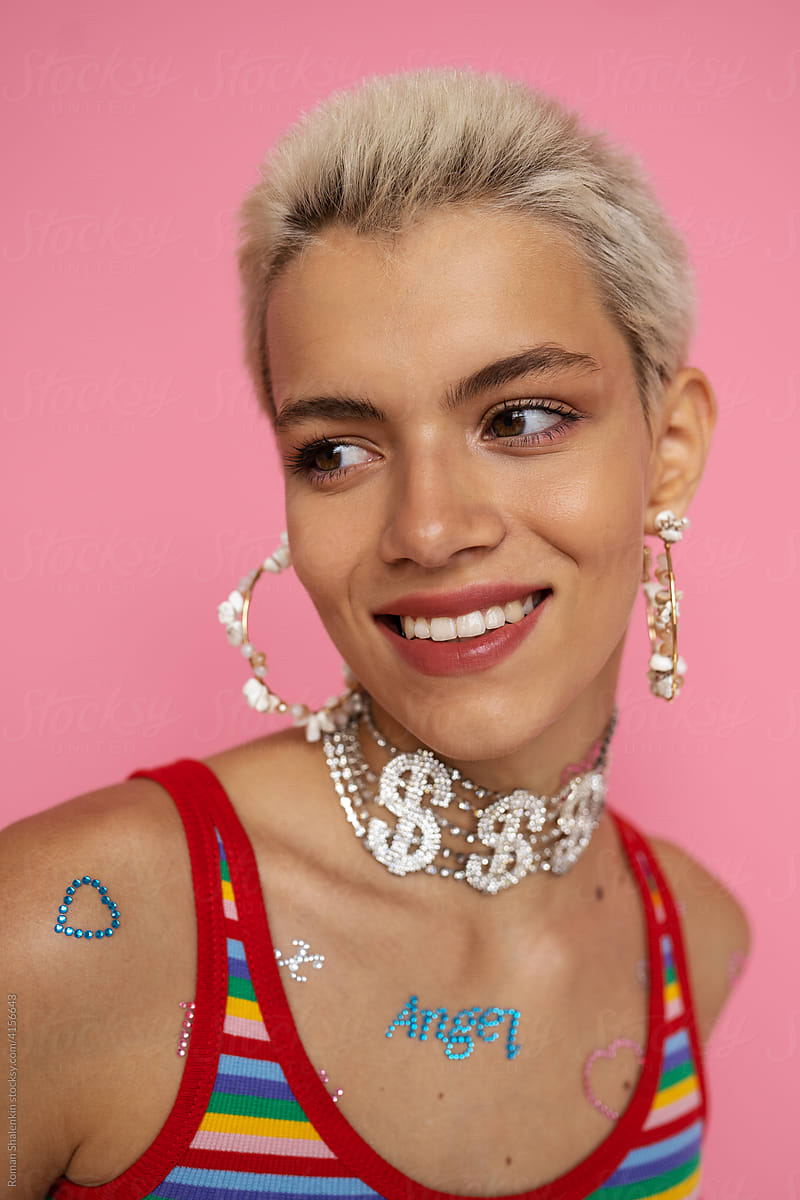 Smiling woman with rhinestones on body