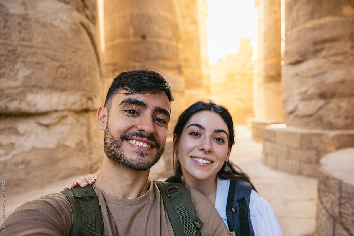 Couple taking a selfie at the Karnak Temple in Egypt.