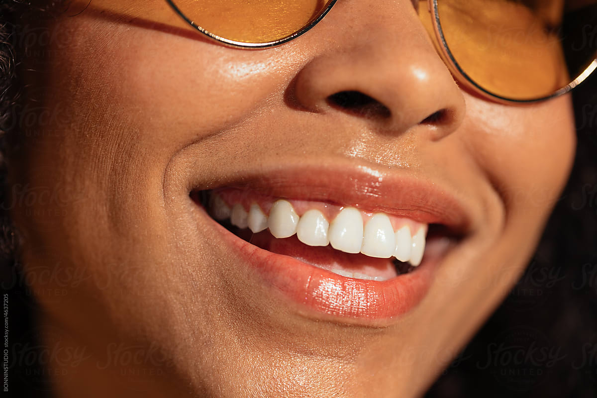 Cheerful black woman with white teeth
