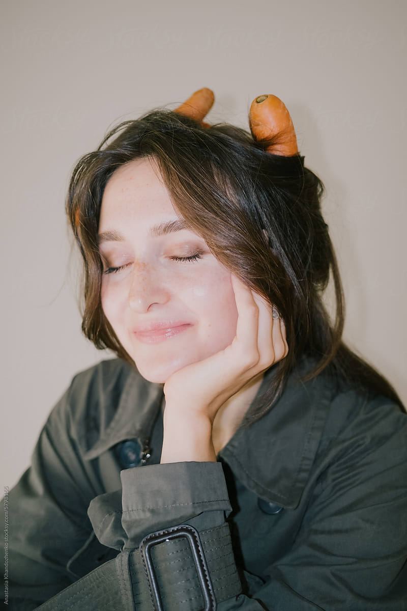 Brunette woman with carrots instead of curlers