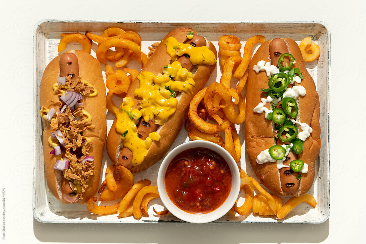 Finger food: grilled hot dogs with condiments and toppings