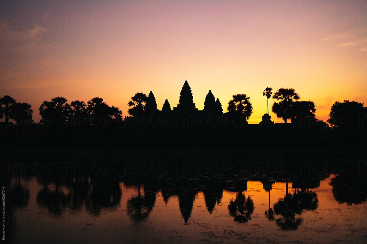 Silhouette view of Angkor Wat temple at sunset