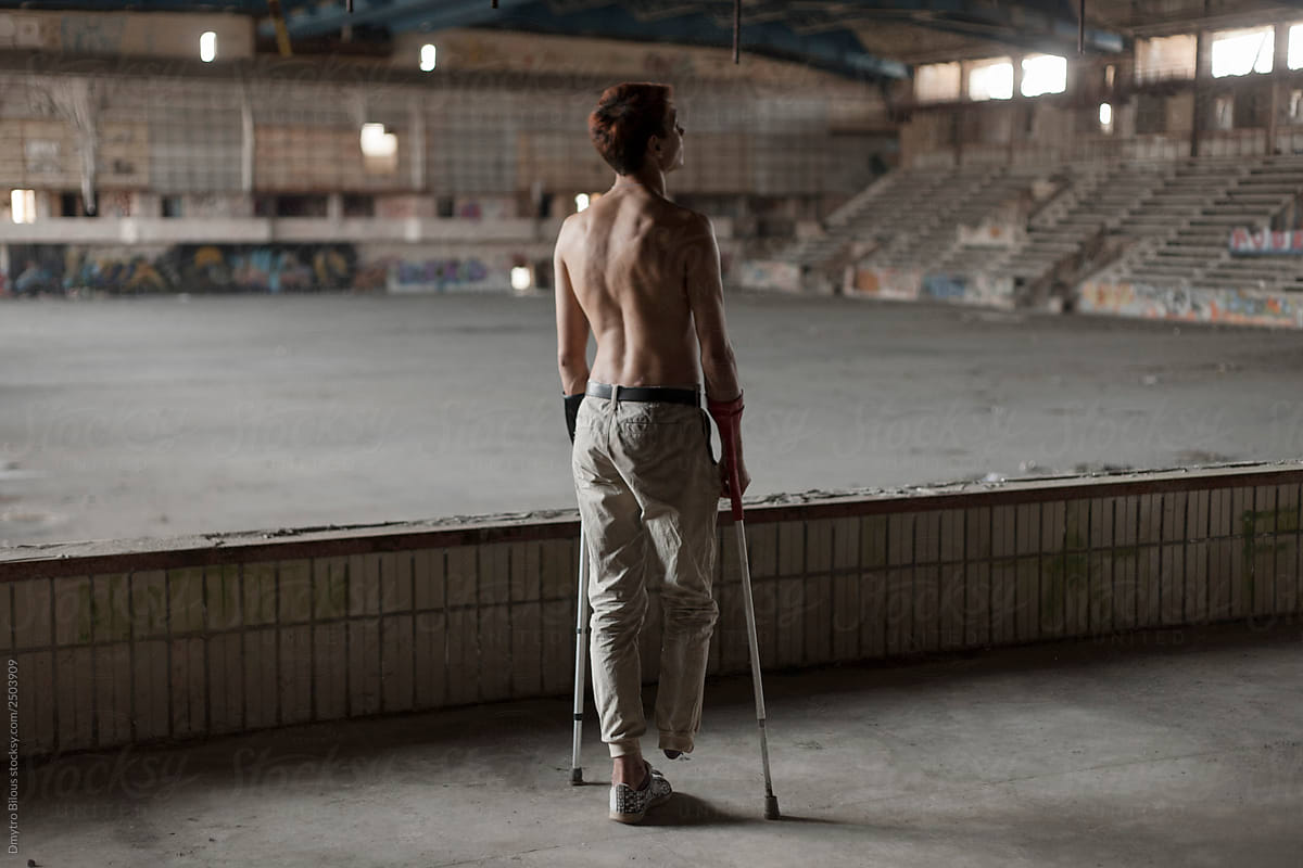 guy on crutches in an abandoned building