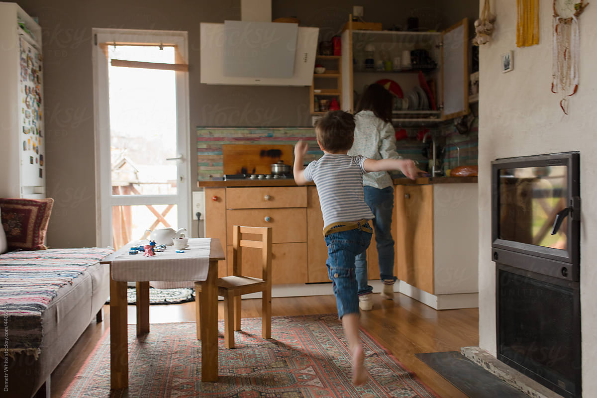 child running around the kitchen