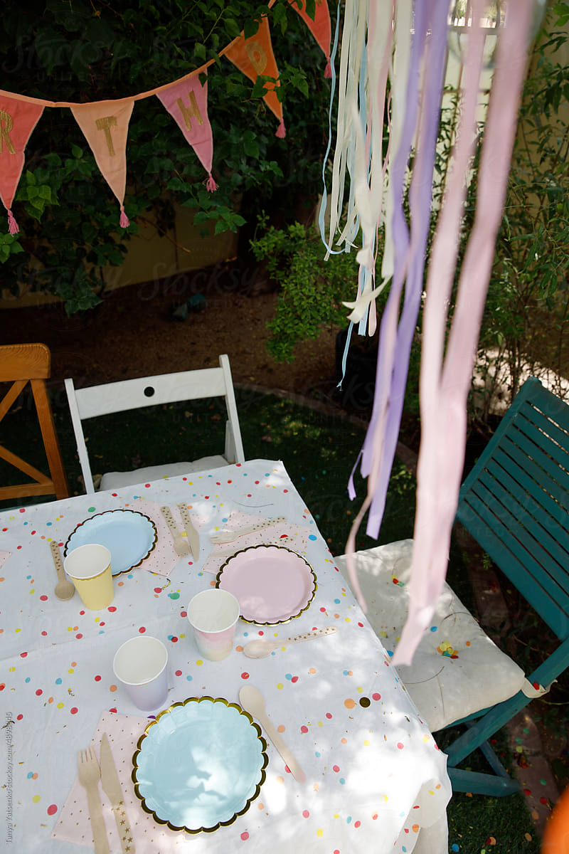A table decorated for a birthday party in the garden