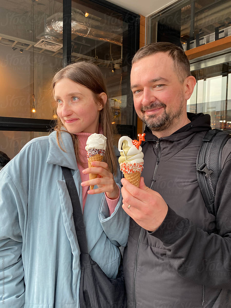 Portrait of two young friends with ice cream