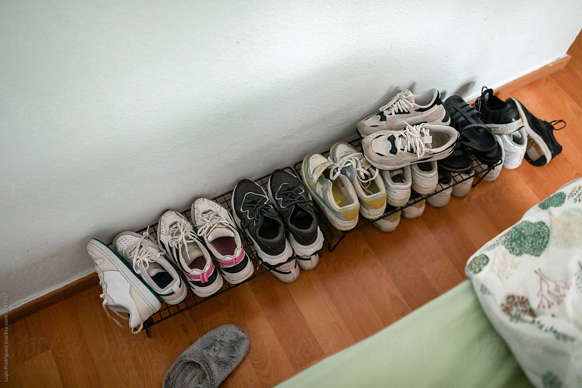 ugc of slippers in a bedroom shoe rack