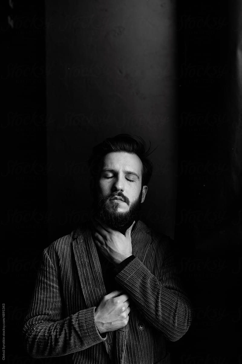 Monochrome portrait of man in isolated studio