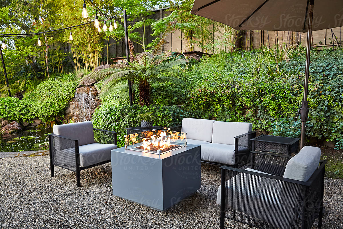 Outdoor seating area with fire pit at luxury hotel
