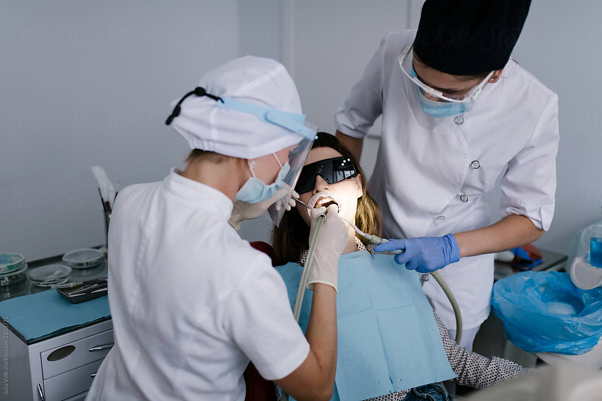 Dental office: Dentist treating patient