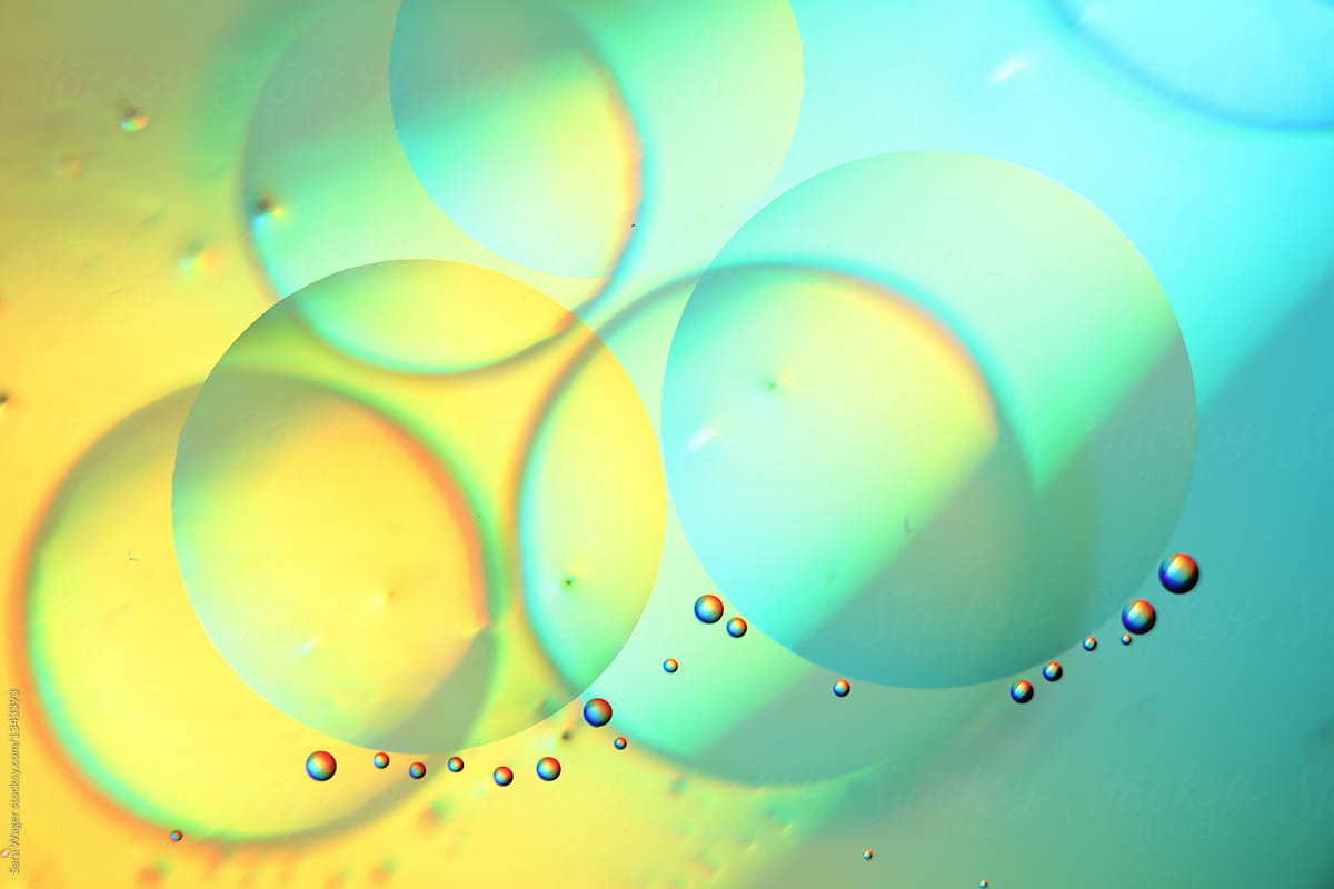 Oil on water colourful yellow and blue bubbles